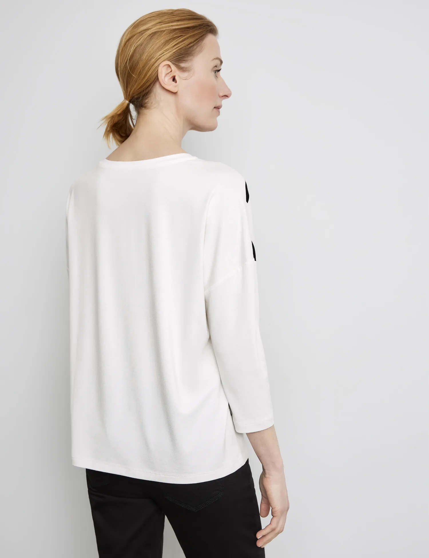 Top with 3/4-length sleeves and lettering